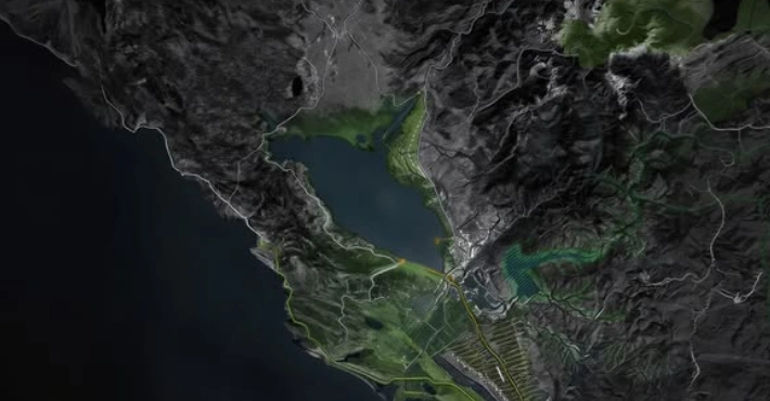 Coastal terrain map with mountain relief, a lake and mapped ground features